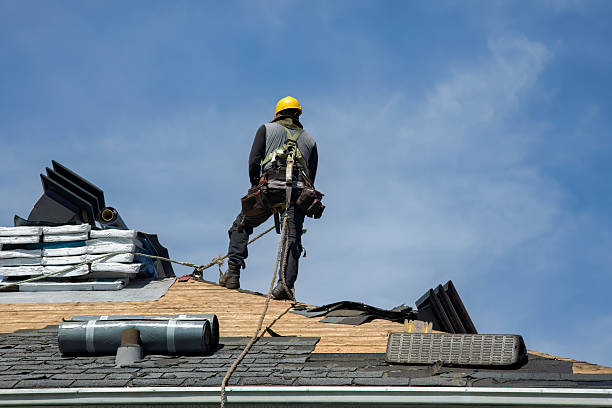 Professional Roof Replacement technician working in Arverne, NY